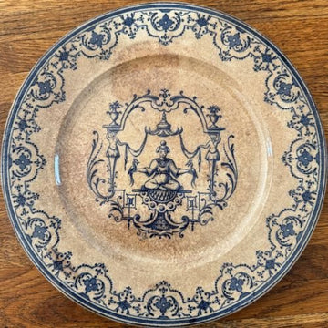 antique french terre de fer plate with blue transferware chinoiserie motif and ornate border on aged cream ground showing heavy patina and pronounced crazing