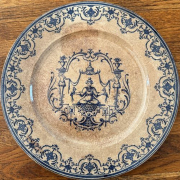 antique french terre de fer plate with blue transferware chinoiserie motif and ornate border on aged cream ground showing heavy patina and pronounced crazing