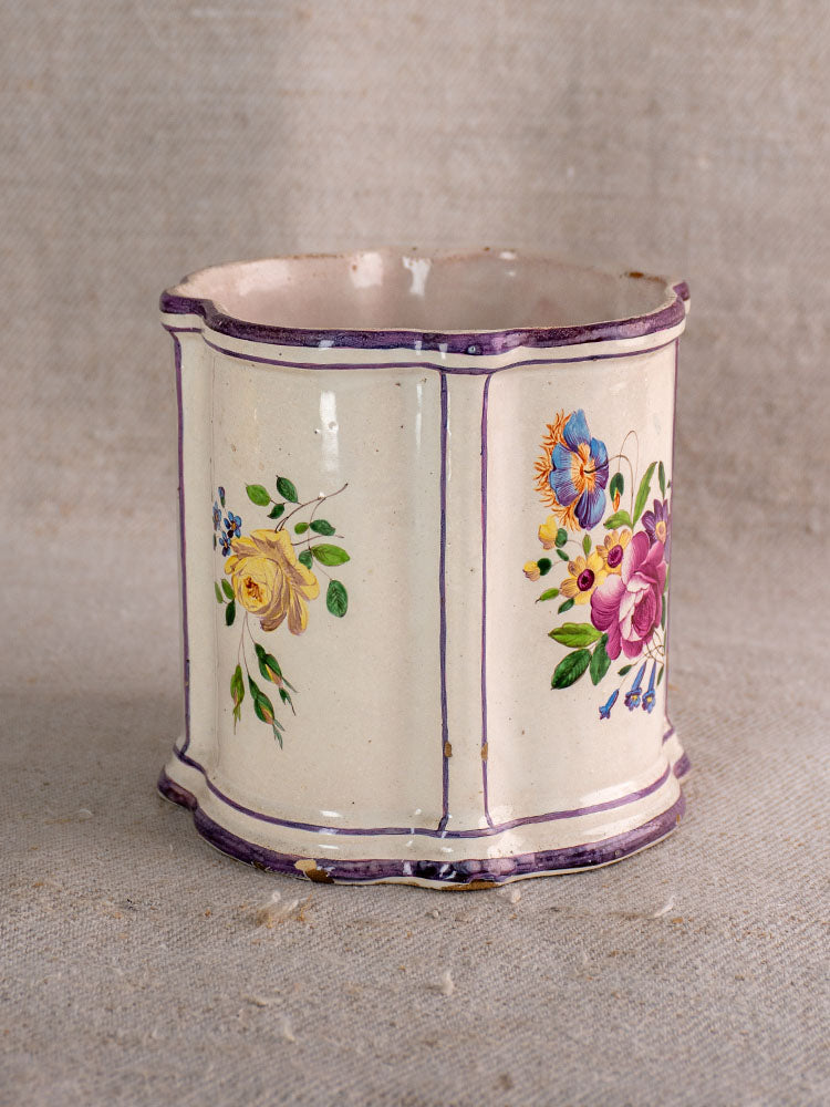 Antique French faience cache pot, 18th century, hand painted chinoiserie style on beige textured fabric background.