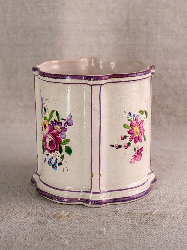 Antique French faience cache pot, 18th century, hand-painted Chinoiserie florals with purple trim on cream, on beige fabric.