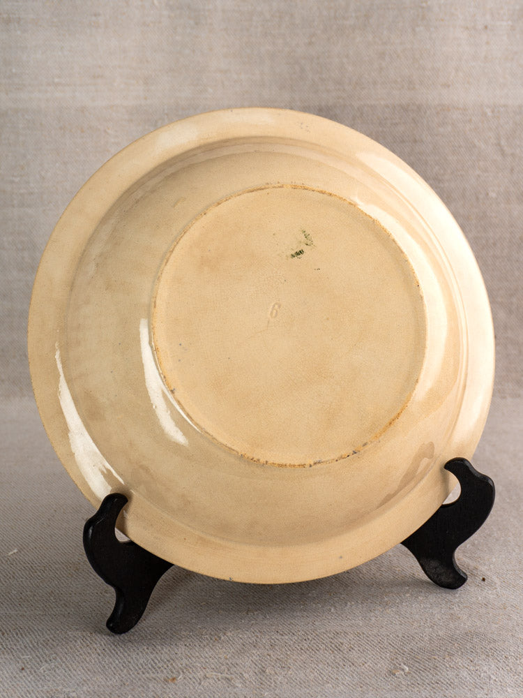 Antique French saladier, Grigny Terre de Fer, glossy finish, inverted on black stand, faint “6” mark.