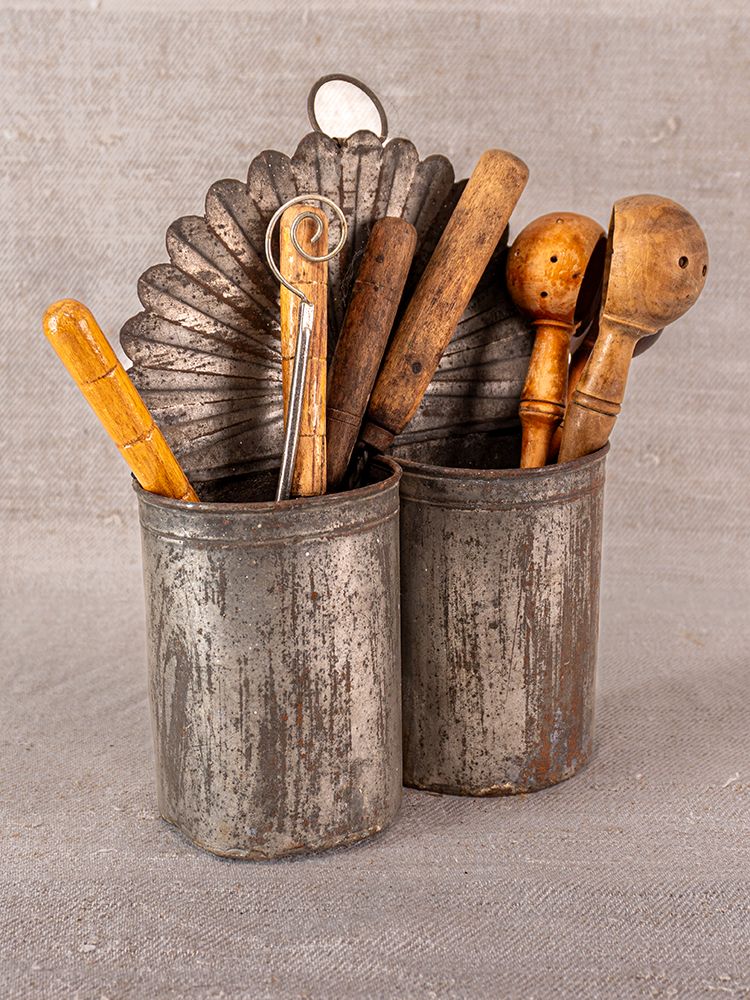 Provençal aged steel wall-mounted utensil holder for vintage wooden spoons, whisks, and Luberon-inspired kitchen decor.