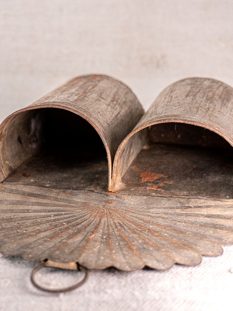 Provençal wall mounted utensil holder in aged steel with two curved compartments and a vintage, weathered finish.