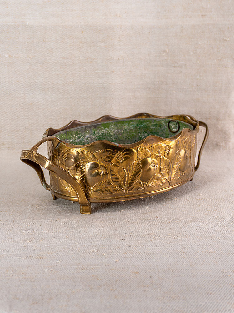 Vintage Swiss brass jardinière with embossed fruit, two handles, and green patina interior. Mid-century design.