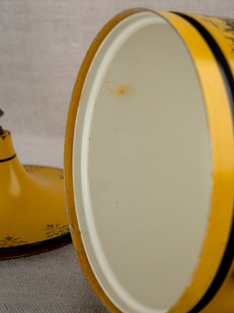 Vintage French Tôle Peinte yellow Directoire-style champagne cooler with black stripe, white interior visible, lid off.