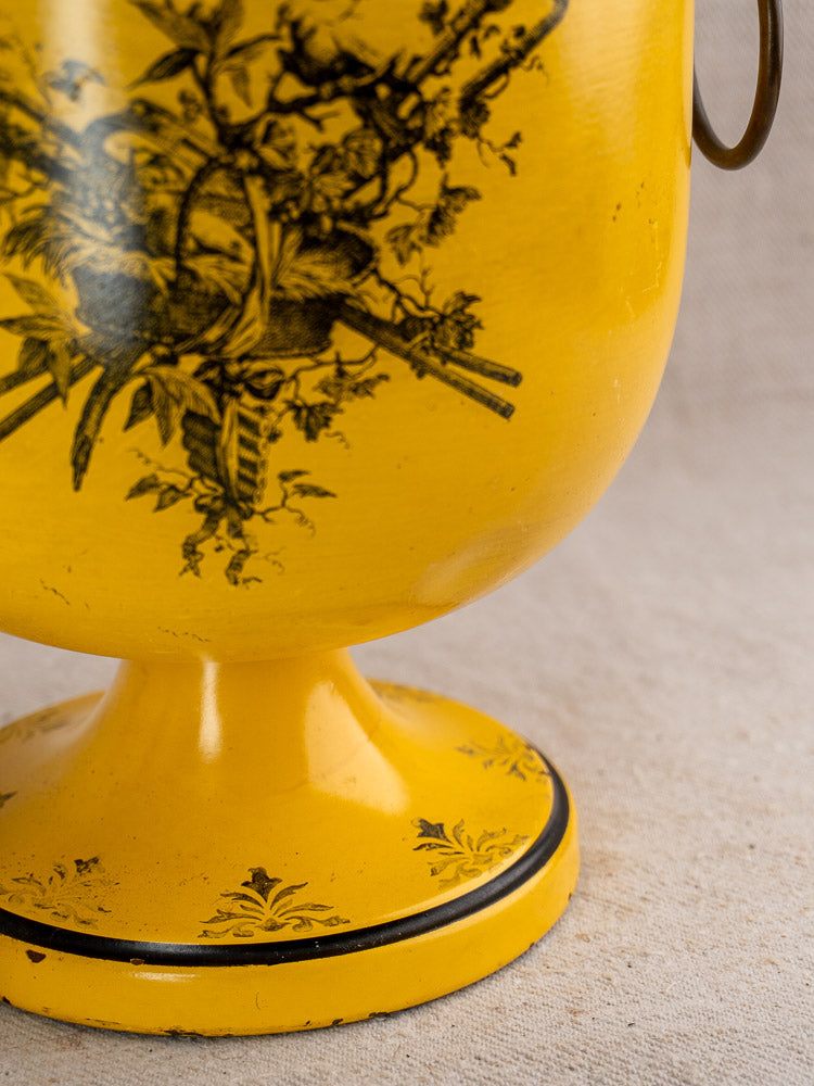 Vintage French Tôle Peinte champagne cooler in yellow Directoire style with black floral and bird motifs.