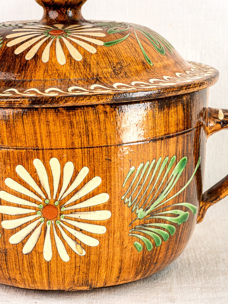 Antique French Alsace glazed terracotta pot with lid, white and green floral slip decoration, rustic handle.
