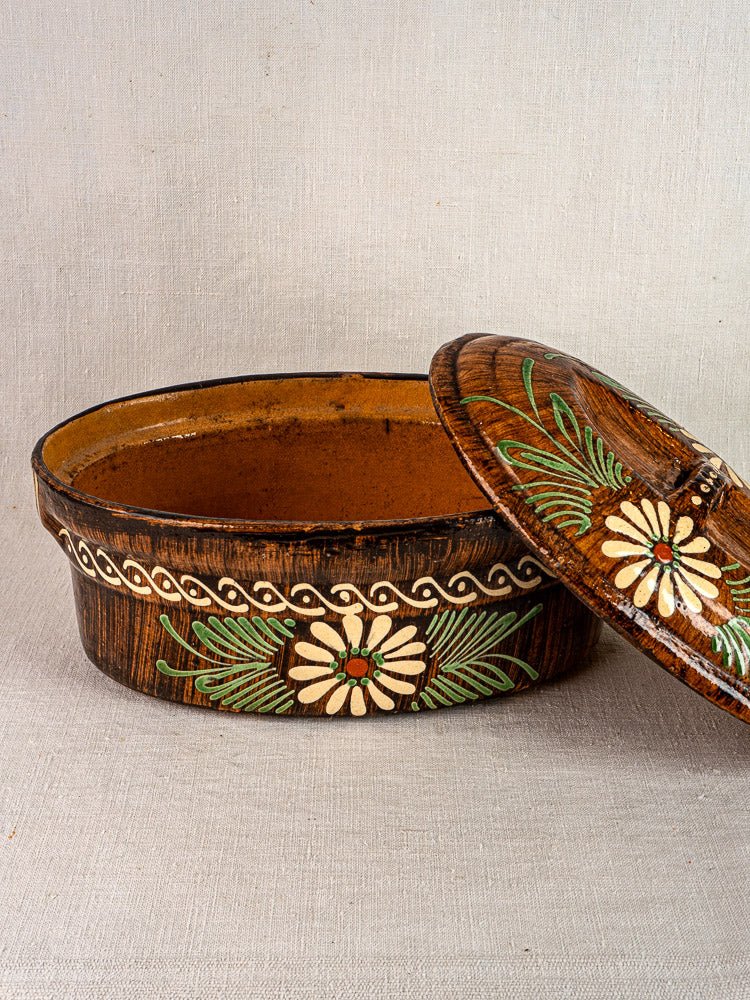 Antique French Alsace glazed terracotta oval dish with lid, slip-decorated floral motif.