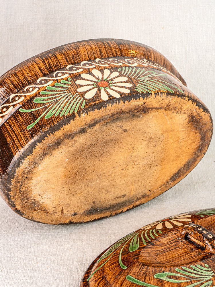 Antique French Alsace glazed terracotta bowl base with slip-decorated floral and leaf motifs.