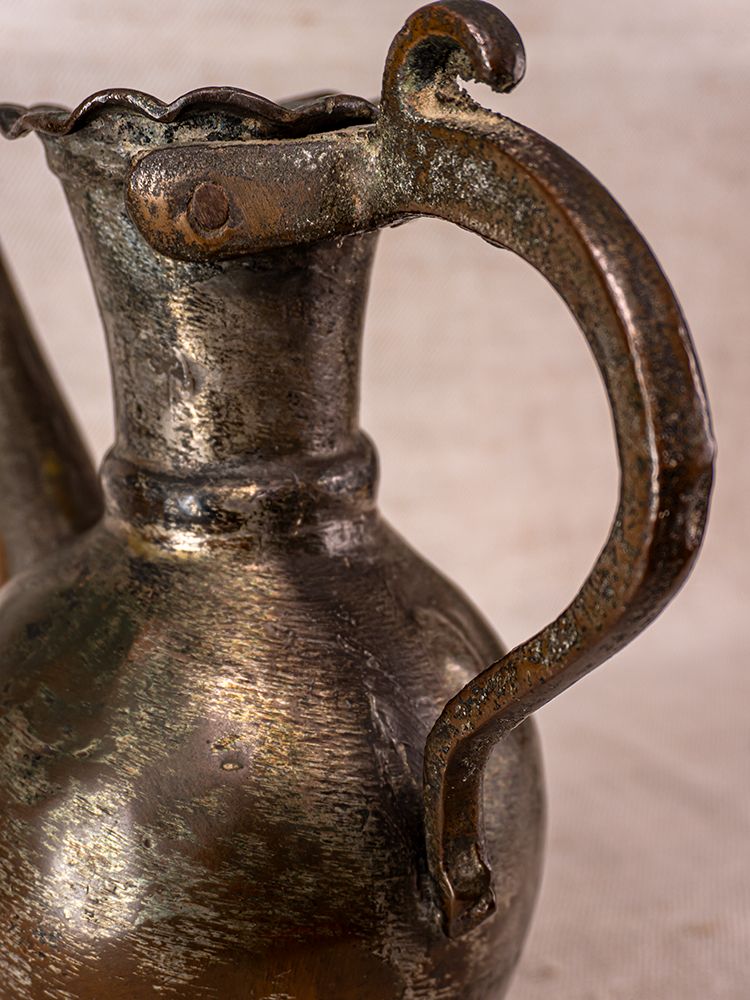 Antique Anatolian tinned copper ibrik watering can, 19th century, with textured surface and scalloped rim.
