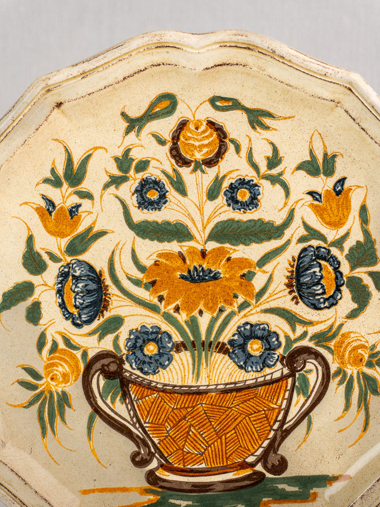 Vintage French Salins Clérissy faience plate with cream glaze, Moustiers-style floral basket design.