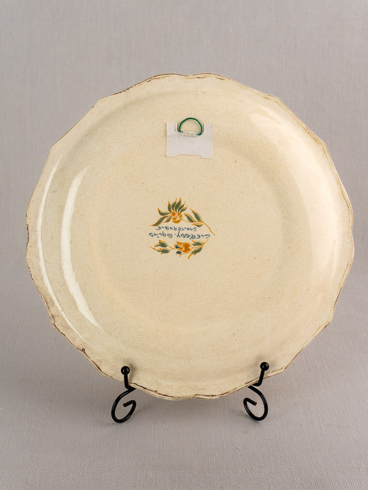 Vintage French Salins Clérissy faience plate with scalloped edges, floral hand-painting, and script verso.