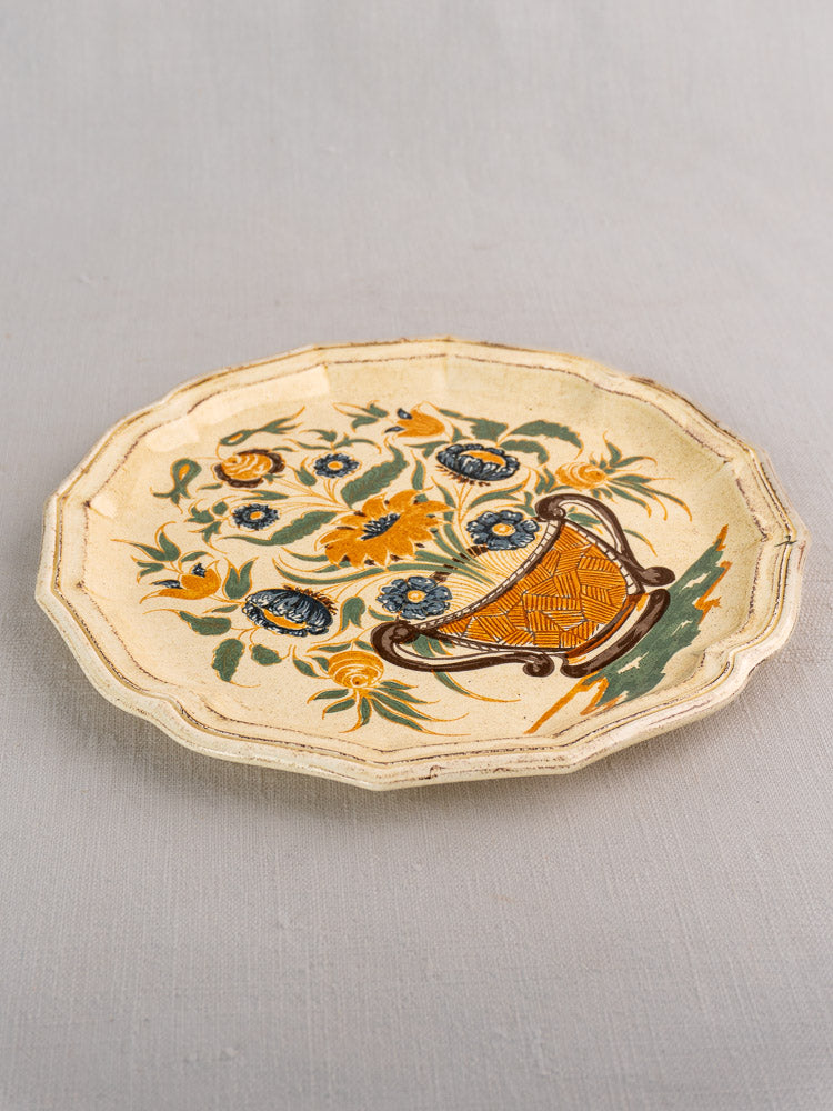 Vintage French Salins Clérissy faience plate with scalloped edges and hand-painted blue and yellow floral basket.