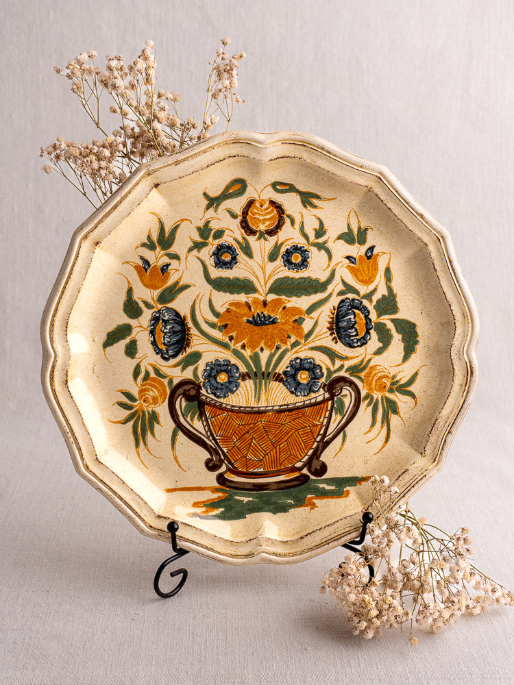 Vintage French Salins Clérissy faience plate, hand-painted floral Moustiers design, displayed with dried flowers.