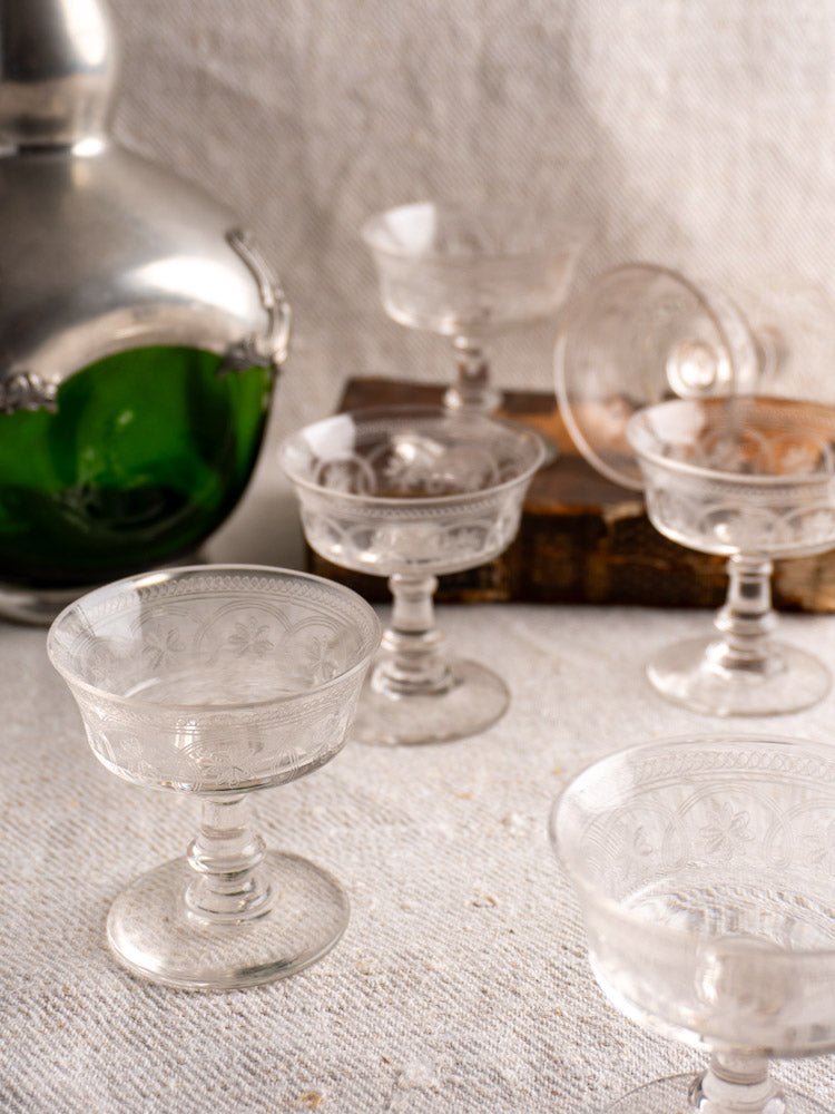 Set of six antique French uranium glass coupes with decanter and wooden box, circa 1900.