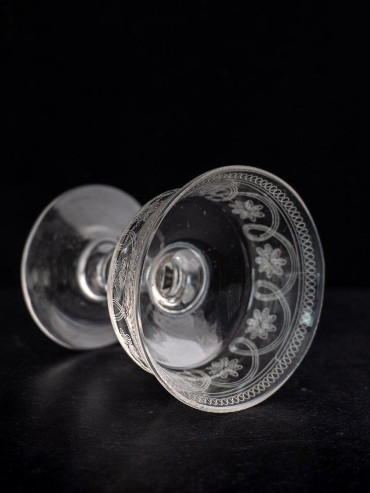 Set of six antique French uranium glass coupes with delicate etched floral and geometric rims.