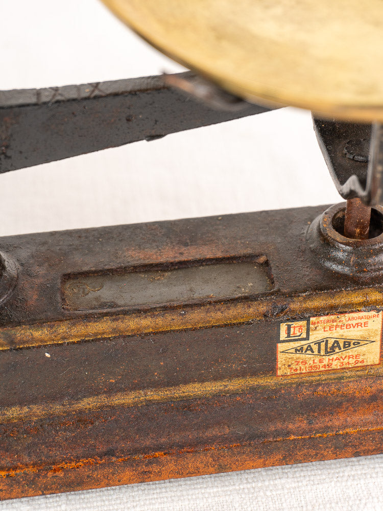 Antique French Roberval Force 5 Kg cast iron and brass balance scale with aged patina and yellowed label.
