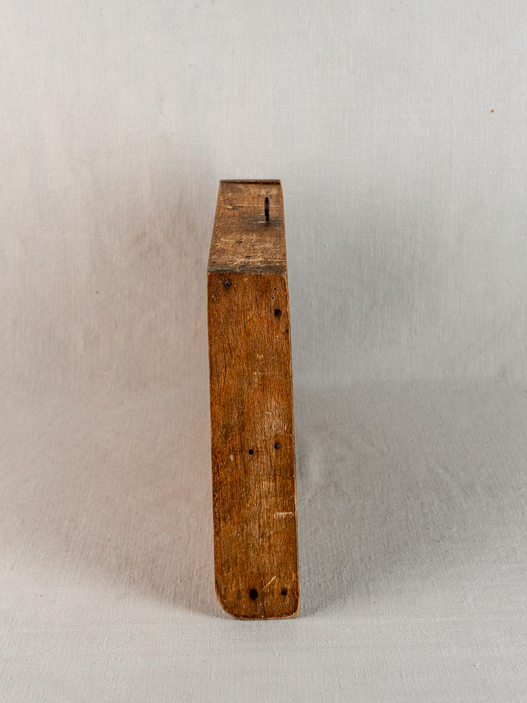Antique French beech cutting board, late 19th century, visible grain and exposed nails, on light gray background.