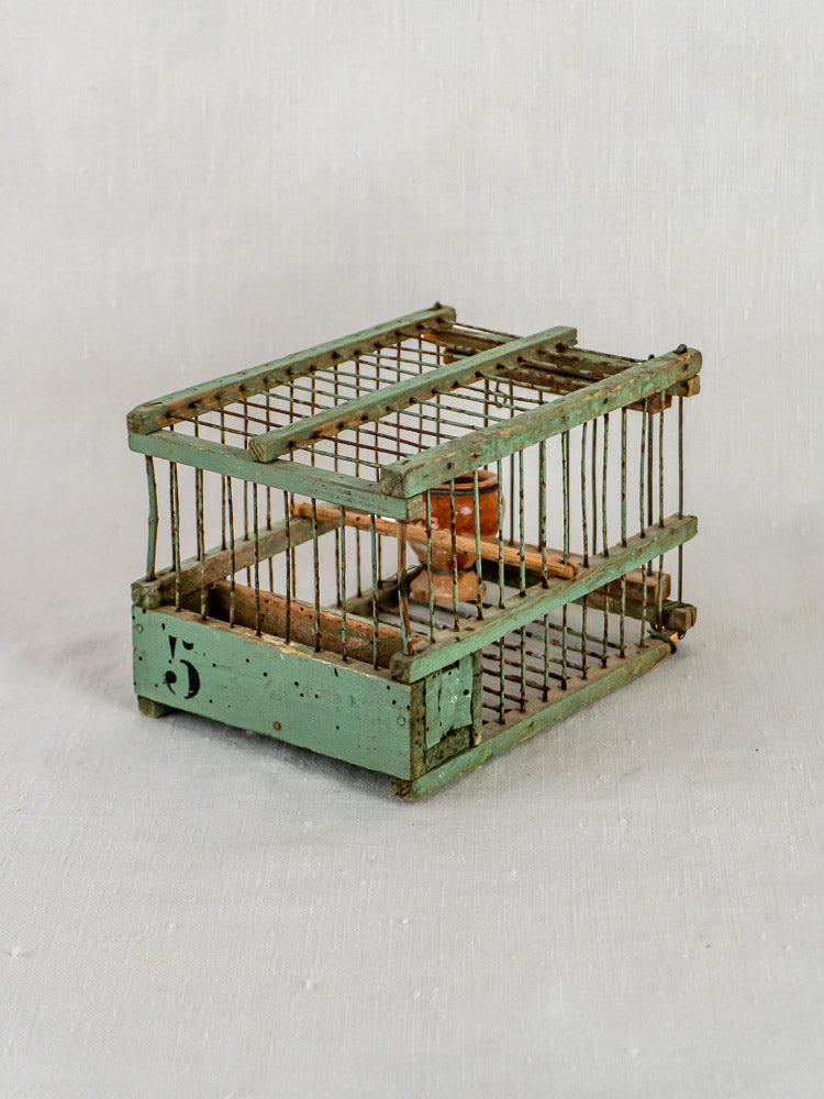Antique French sage green metal and wood decoy bird cage with weathered patina and rust.