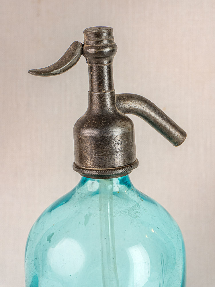 J. Dubuche Aqua Soda Siphon, antique French seltzer bottle with metal top and vivid blue glass.