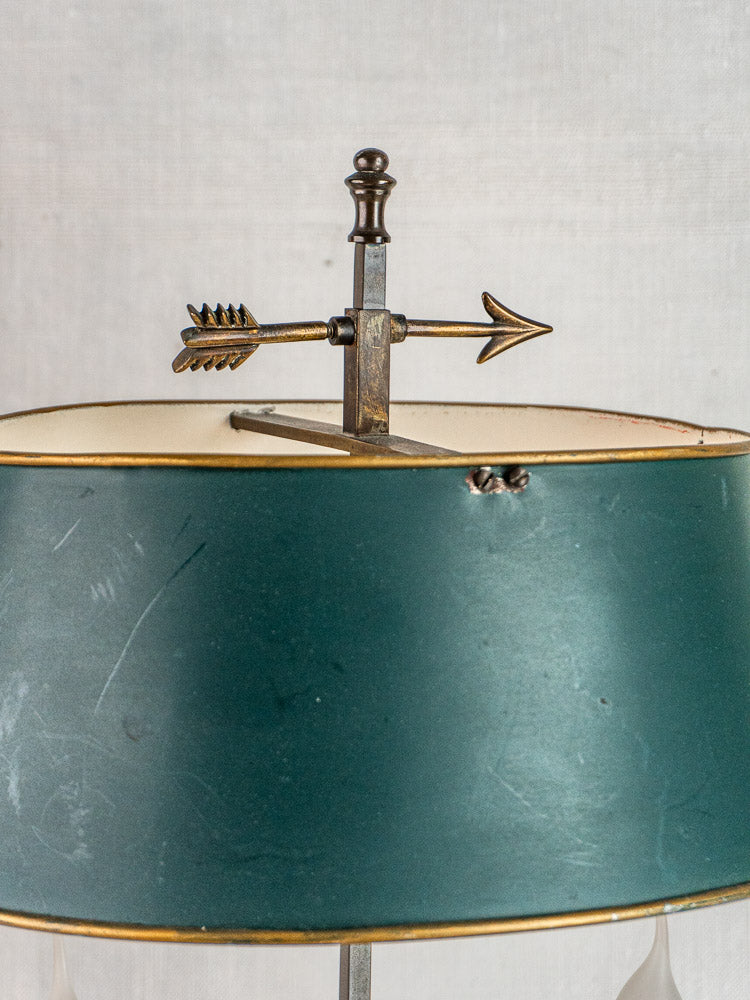 French Bouillotte lamp with vintage green tôle shade, gold trim, and arrow-cross finial, Louis XVI-inspired.