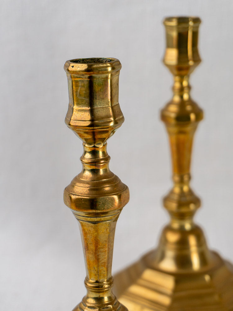 Louis XV antique French brass candlesticks, circa 1750, ornate 18th-century design, polished gold finish.