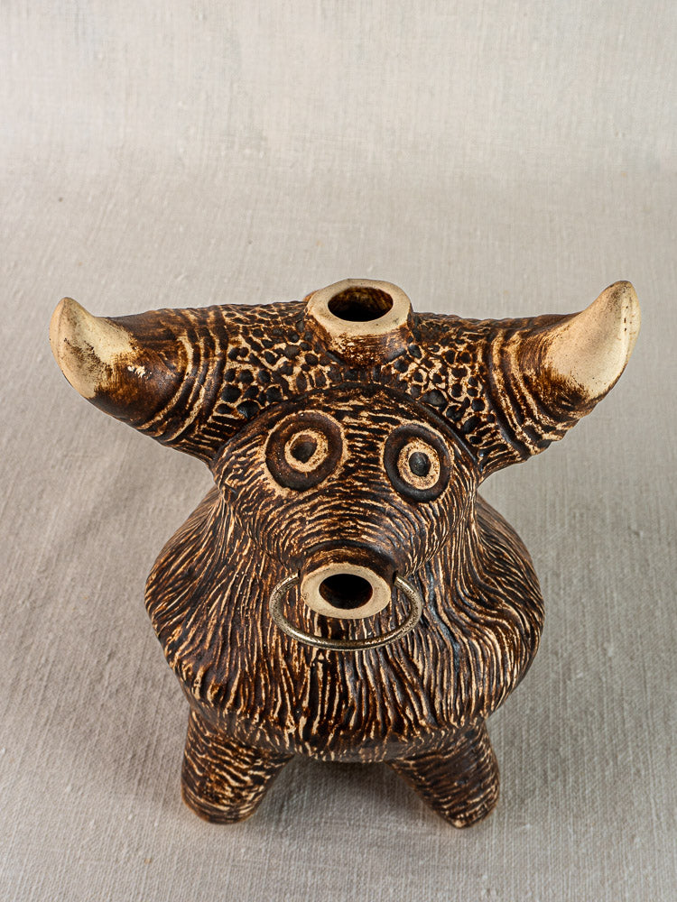 Vintage French bull-shaped ceramic pitcher with textured brown fur, upright horns, and three circular face openings.