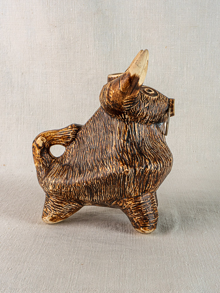 Vintage French bull pitcher, 1950s ceramic, brown and beige glaze, textured finish with curved tail and pointed horns.