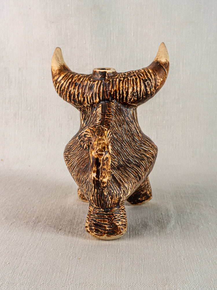 Vintage French ceramic bull-shaped pitcher, 1950s, brown and tan glazed, large horns, on neutral fabric backdrop.