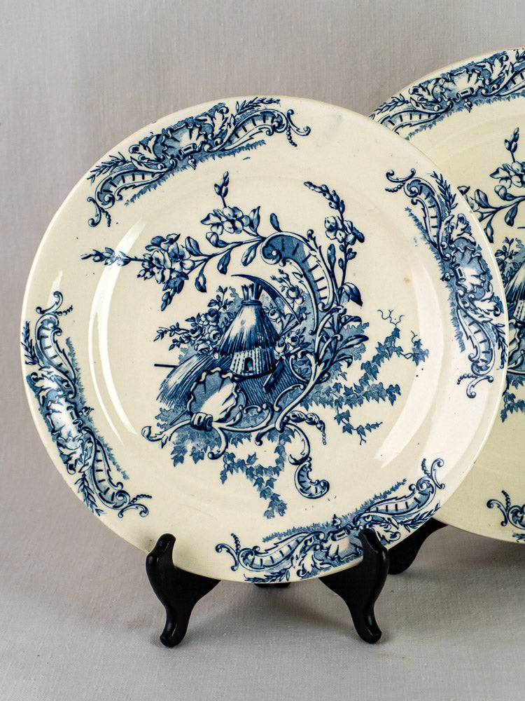 Clairefontaine Louis XV antique French Terre de Fer platter with blue floral motifs and central figural scene.