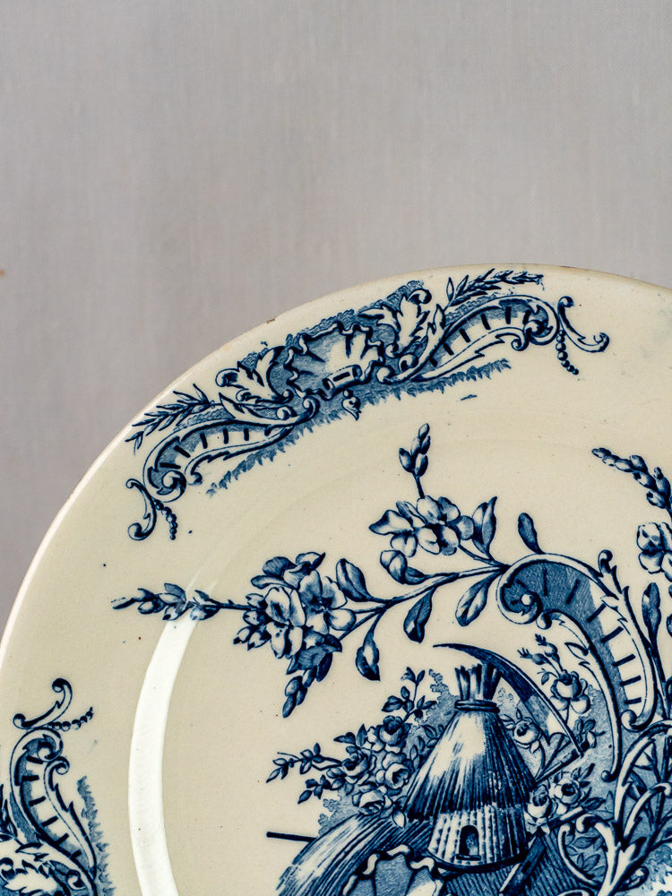 Clairefontaine Louis XV antique French Terre de Fer platter with intricate blue floral scrollwork on cream.