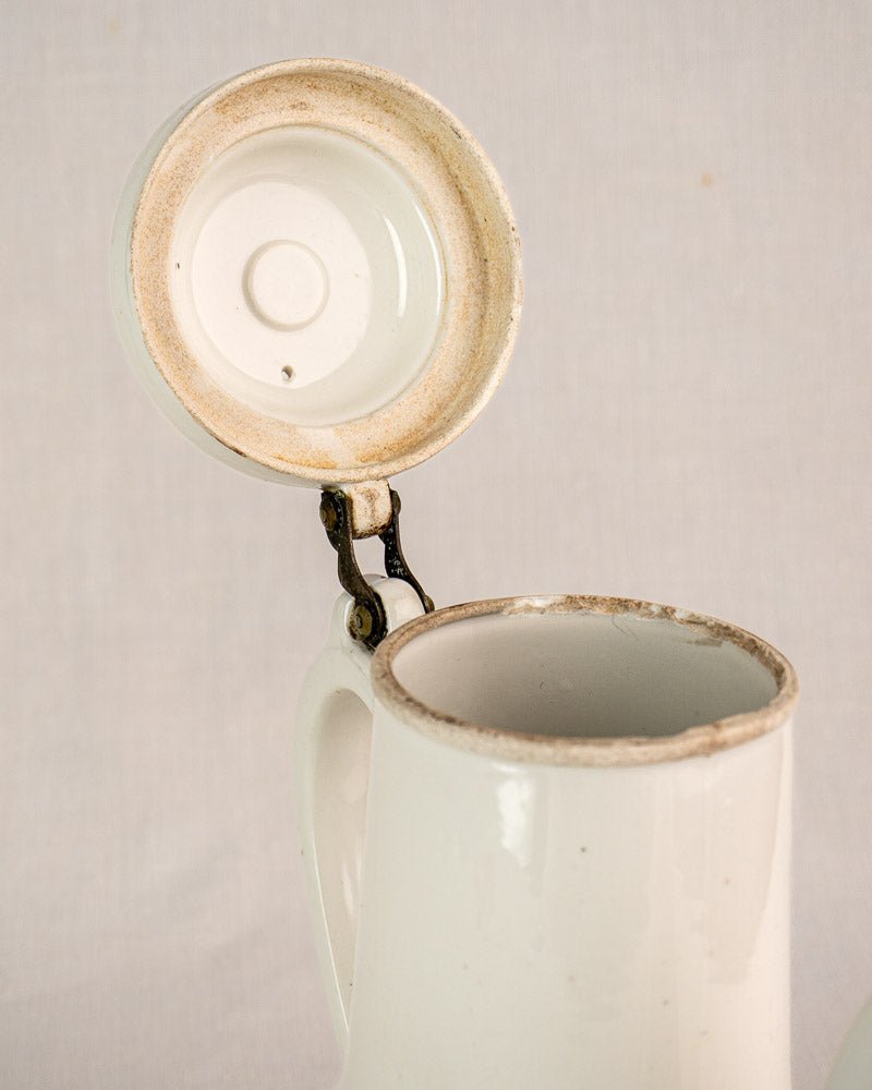 Early 20th-century French Limoges Frugier Aluminite porcelain coffee pot with metal-hinged lid, slight wear.