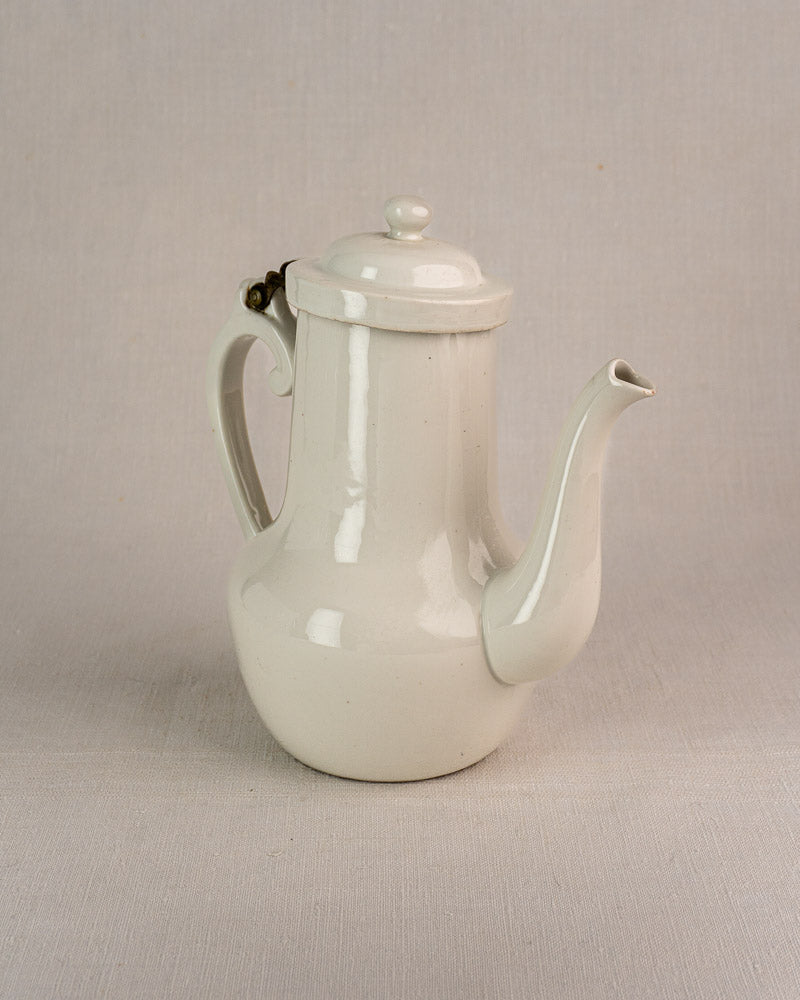 Early 20th-century French Limoges Frugier aluminite porcelain coffee pot with lid and curved spout.