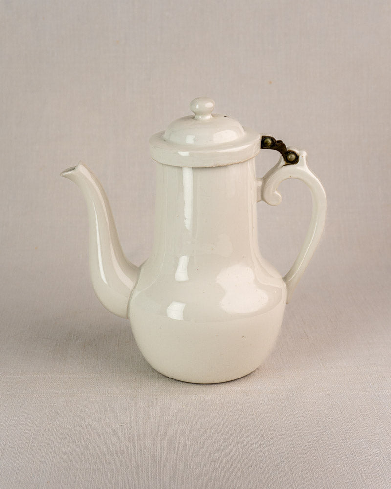 French Limoges aluminite porcelain coffee pot by Frugier with curved spout and hinged handle.