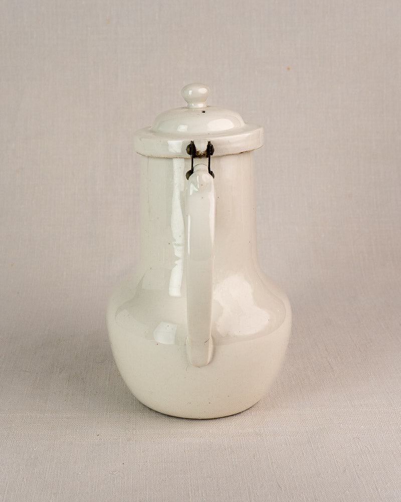 French Limoges Aluminite porcelain coffee pot by Frugier with lid and curved handle, white finish.