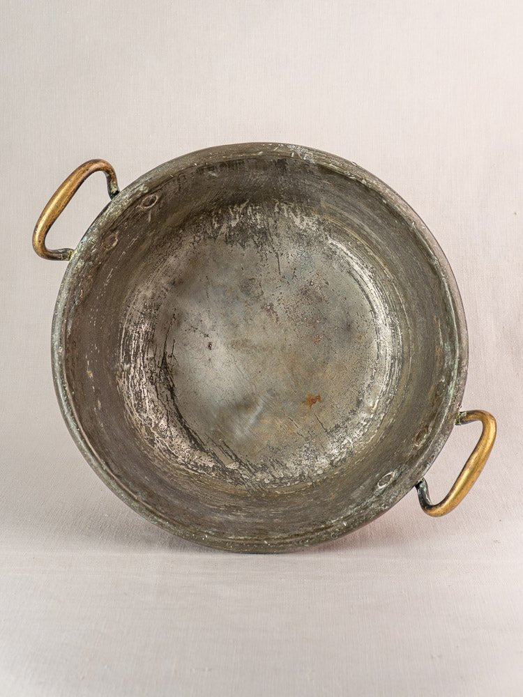 Antique French copper jam pan with brass handles, late 19th century, on light background.