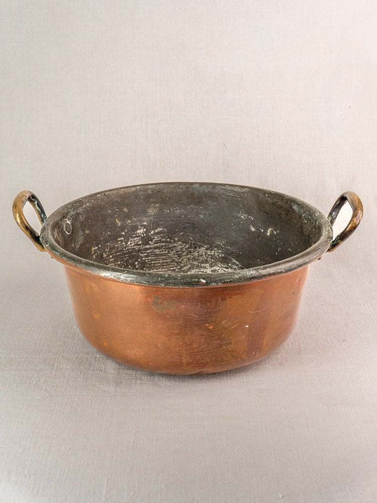 Antique French copper jam pan with brass handles and patina, late 19th century, on neutral background.