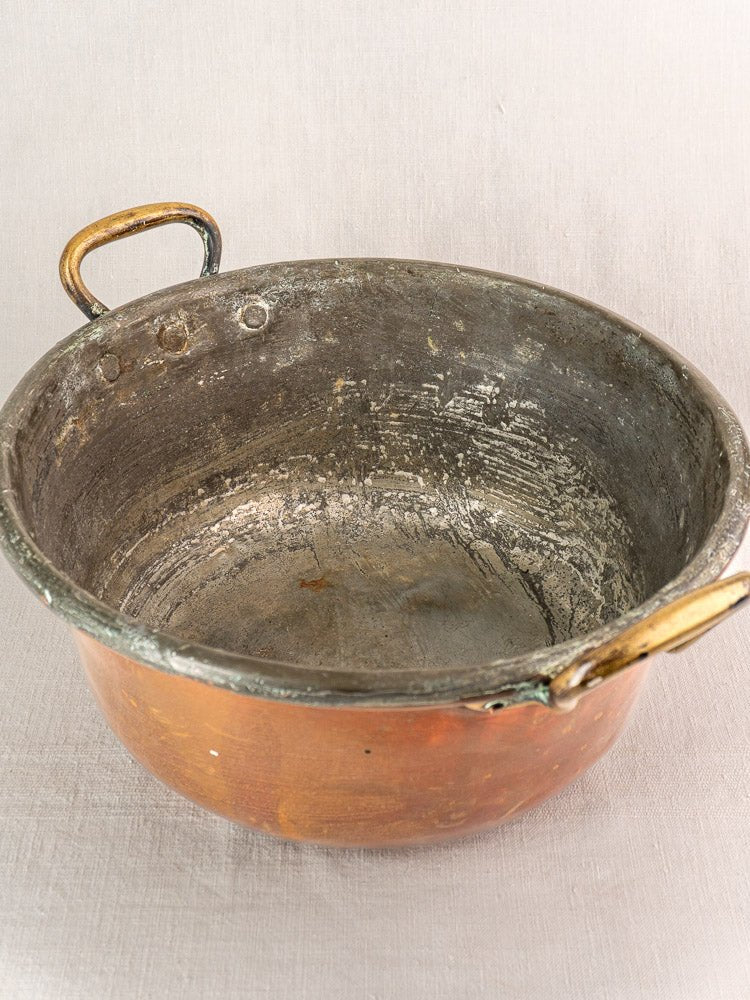 Antique French copper jam pan with brass handles, late 19th century, richly patinated interior.
