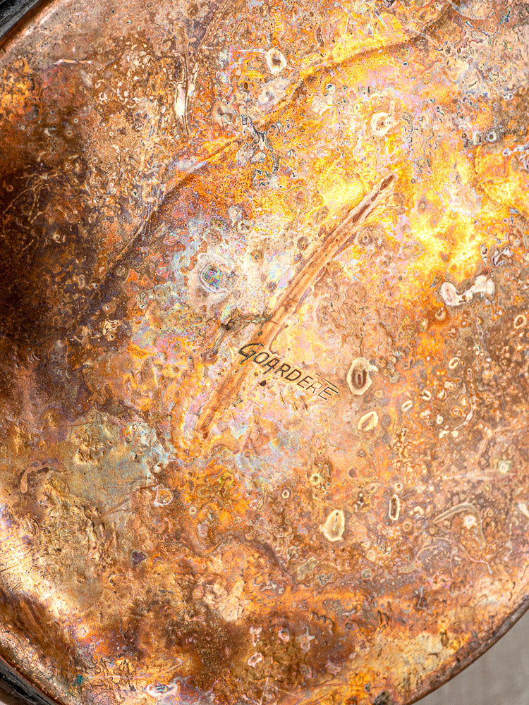Heavily tarnished copper surface with engraved “GOBARDIE” and colorful patina, French watering can detail.
