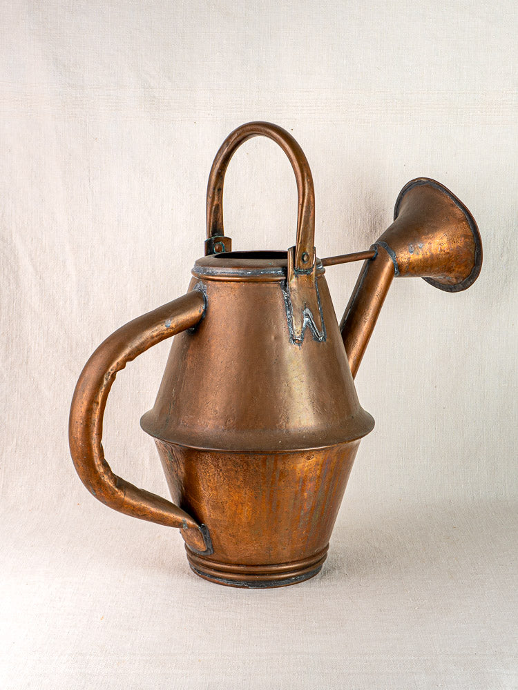 Vintage French copper watering can by Jean Goardère, Villedieu MOF, with curved handle and long spout.