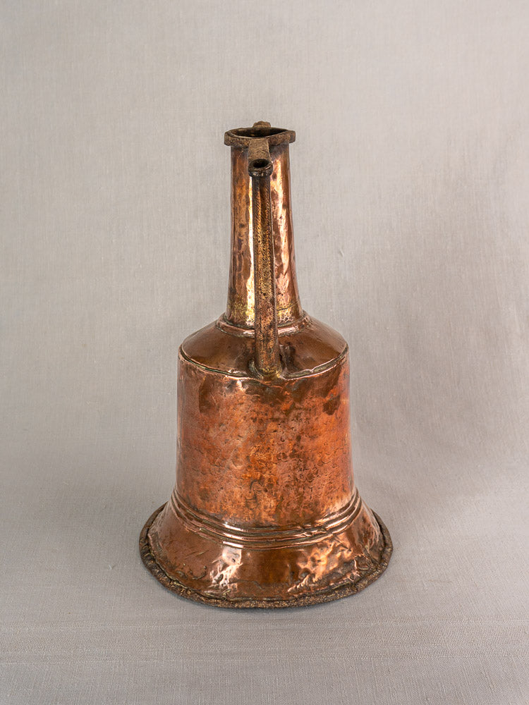 19th-century French hammered copper water jar with twin iron handles, long neck, and wide flared base. Rustic patina.