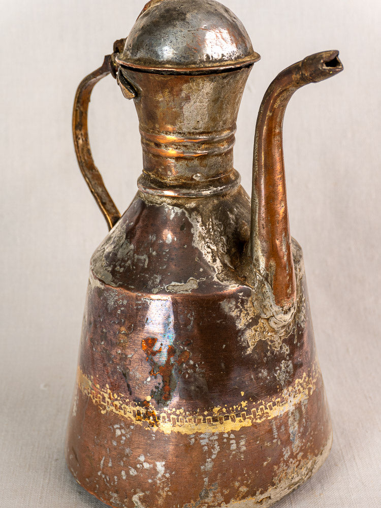 19th century French copper oil pouring jug, hand hammered, domed lid with patina and subtle golden patterns.