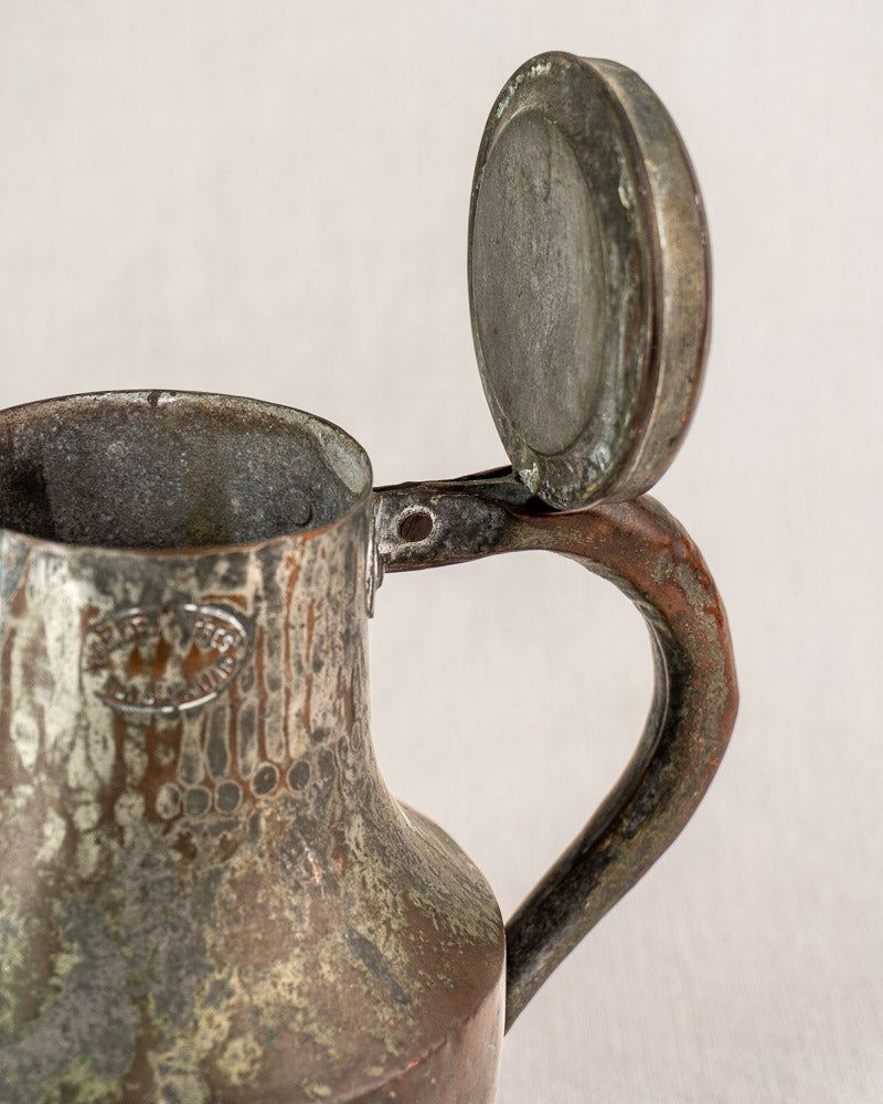 Antique French copper Coquemar pitcher by Allez Frères Paris with open hinged lid and curved handle, worn patina.