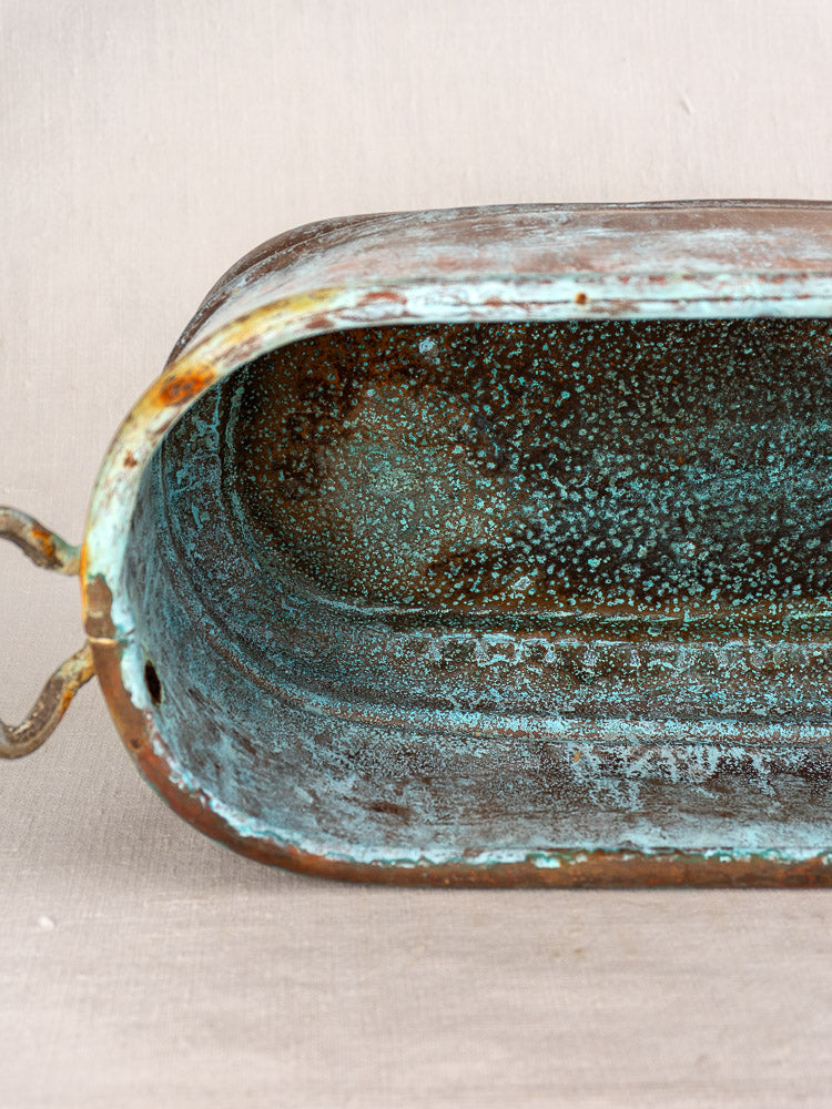 Antique French copper poissonnière jardinière with turquoise verdigris patina and textured surface, featuring two small handles.