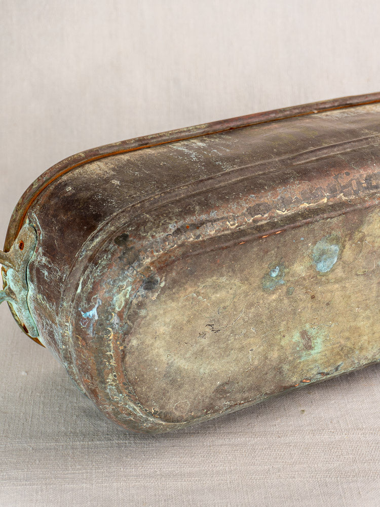 Antique French copper poissonnière jardinière with tarnished rectangular form, rounded edges, and verdigris patina.