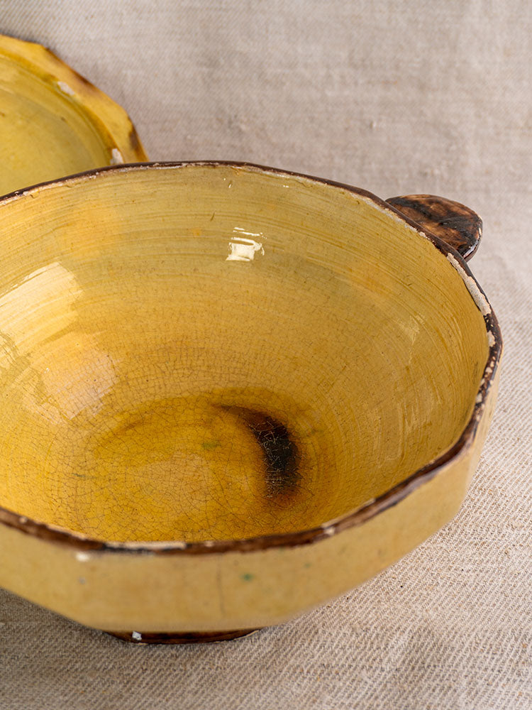Antique French Vallauris Beretta et Cie pottery set with mustard glaze, brown rim, handle, and crackle finish.