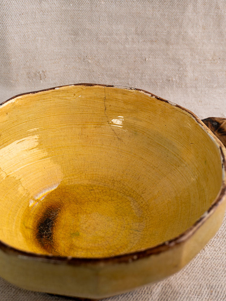 Vallauris Beretta et Cie French pottery table service, mustard-glazed three-piece set with crackled finish on beige fabric.
