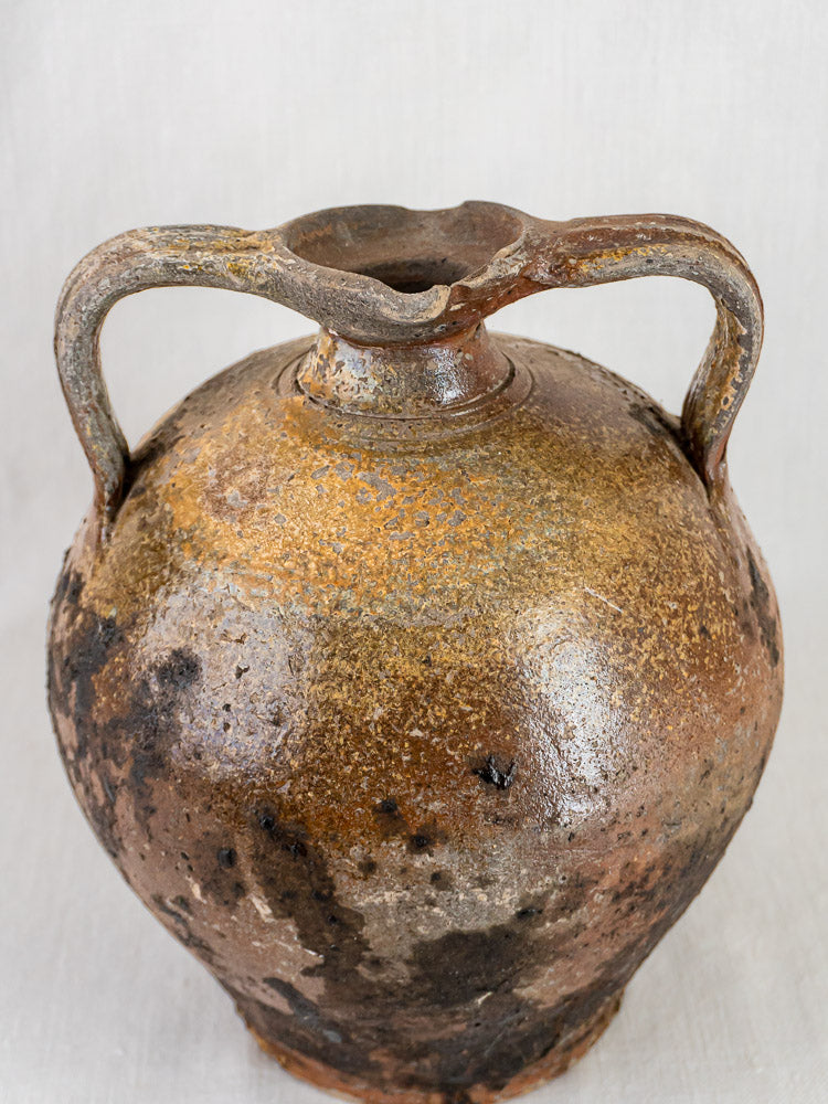 Antique French Orjol, 18th-century terracotta pouring jar with looped handles and weathered brown finish.