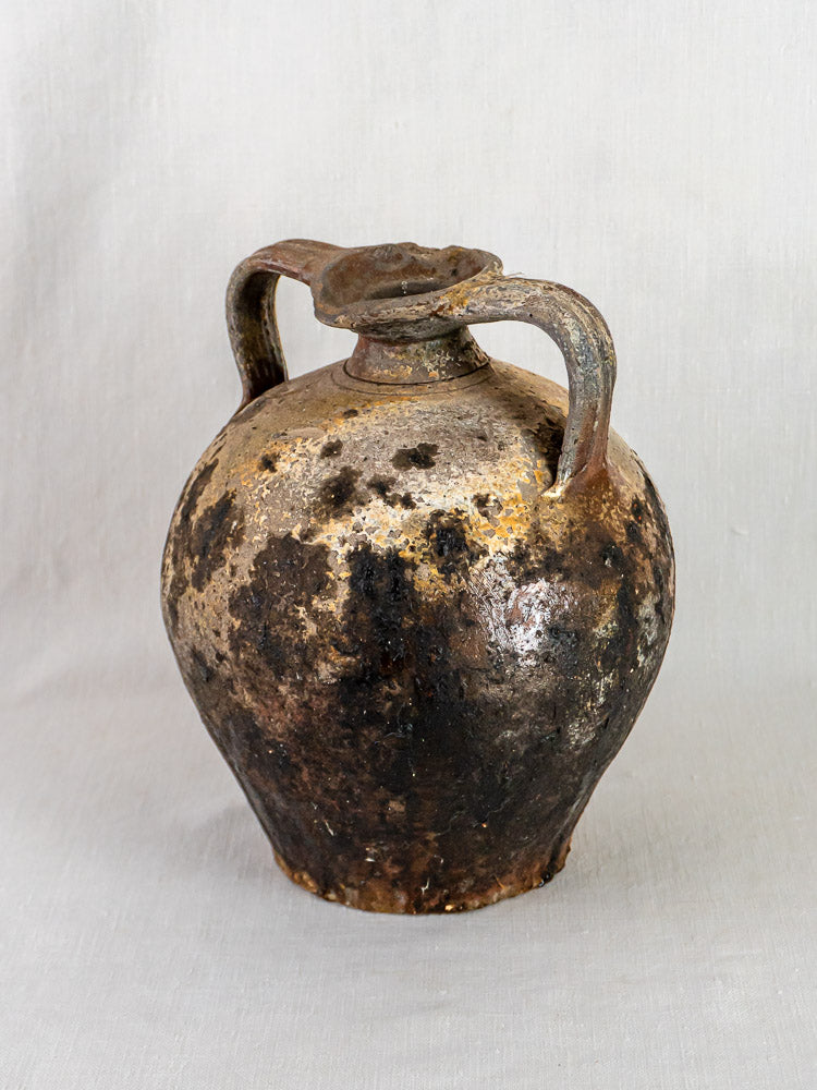 Antique French Orjol, 18th-century terracotta pouring jar with aged patina and two curved handles.