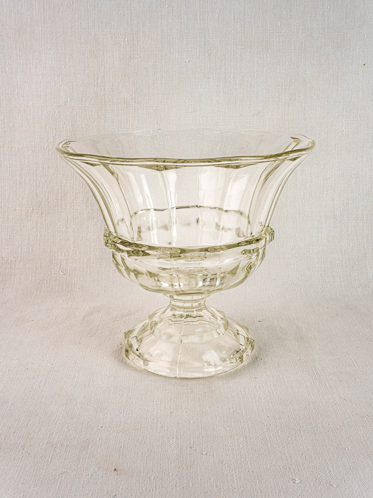 Antique French Coupe Médicis compotier in clear cristallin glass with flared rim, light background.